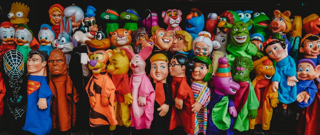 assorted Disney character toysd colorful puppets, puppet theater, character names