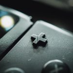 black and gray game controller nintendo switch game cartridges, game card slot, handheld console close up