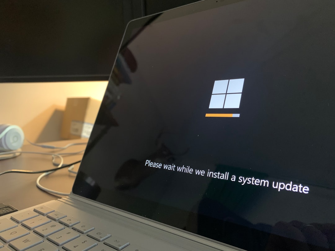 black and white laptop computer windows update settings screen, driver update notification, gaming setup desk