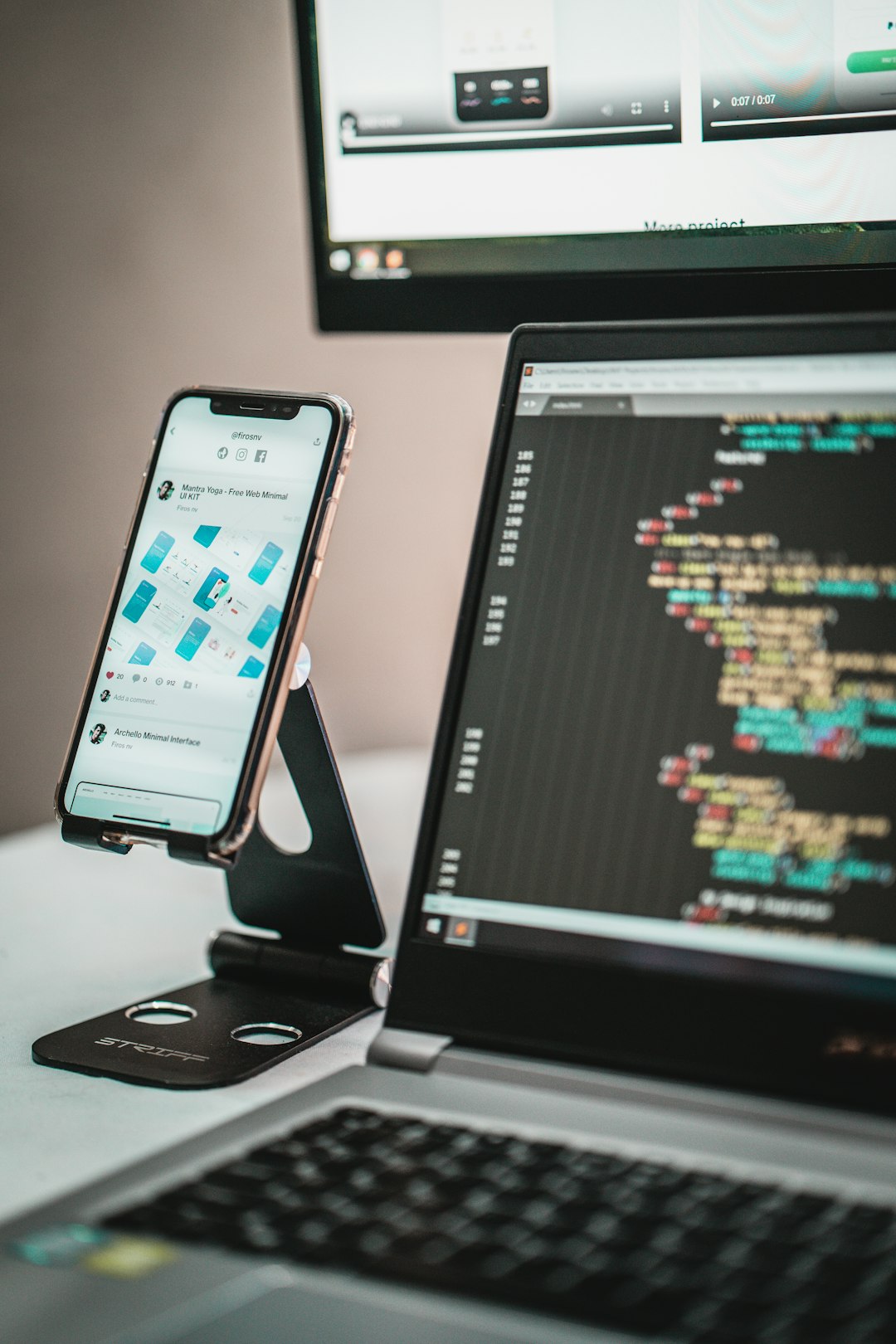black android smartphone on macbook pro mobile app development, firebase console, cloud database, smartphone coding