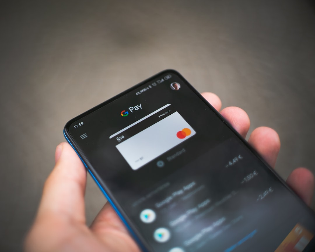 black samsung android smartphone displaying icons global commerce, mobile checkout, online payments, merchants