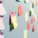 colorful sticky notes pinned to board call notes, consultant planning, next steps
