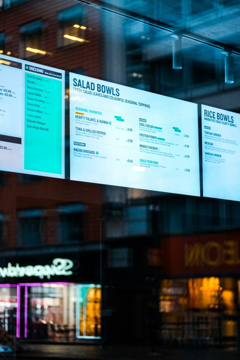 Digital menu boards display salad and rice bowls. real estate agent dashboard, crm software interface, sales pipeline screen