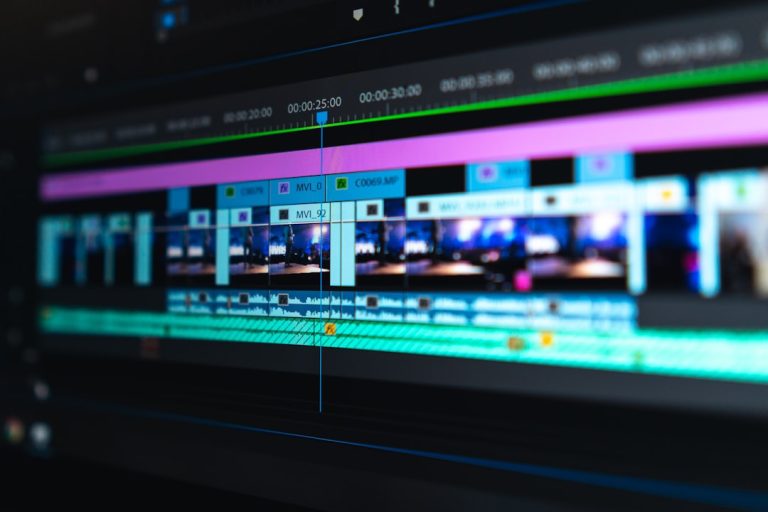 flat screen monitor video editing interface, subtitle timeline, transcription software screen