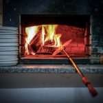 lighted fireplace beside white plates amazon fire stick settings applications manage installed applications