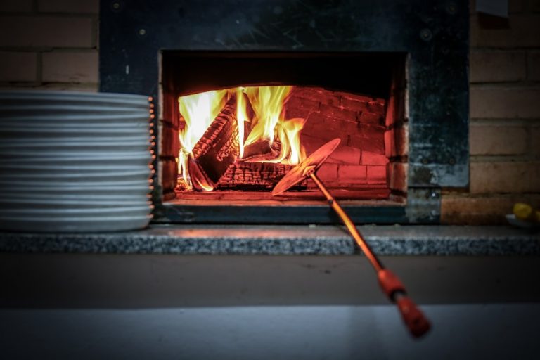 lighted fireplace beside white plates amazon fire stick settings applications manage installed applications