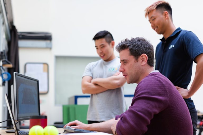 man in maroon long sleeve shirt holding a book enterprise automation software, cloud integration, team collaboration tools