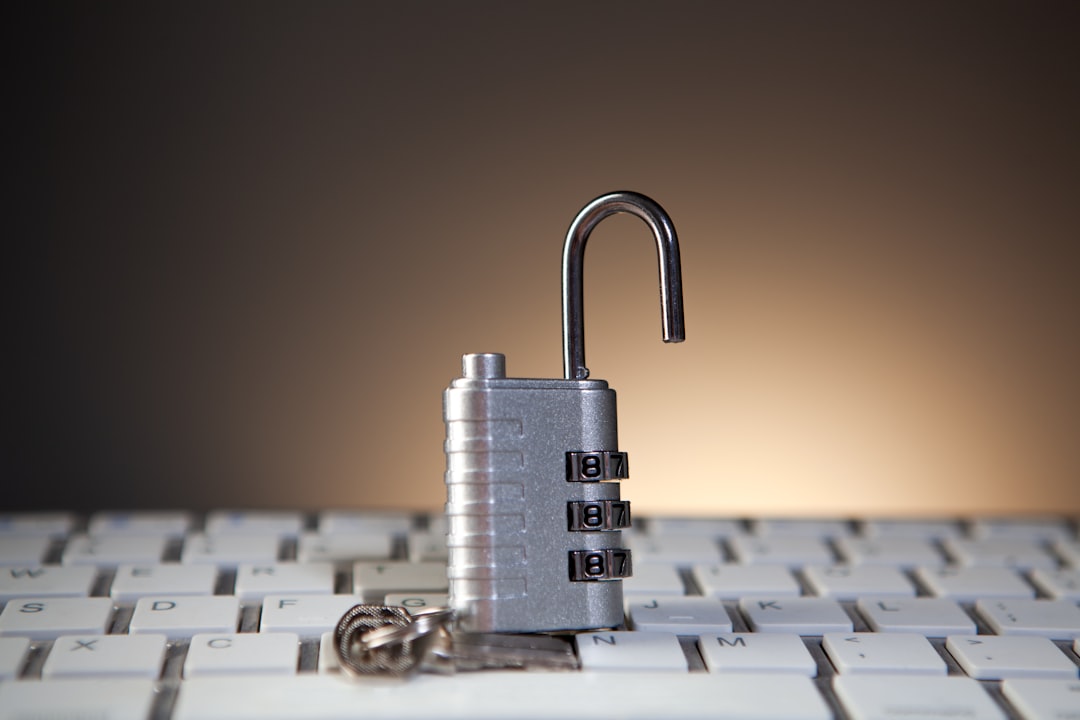Open padlock with combination lock on keyboard cyber security shield, encrypted cloud, data protection concept
