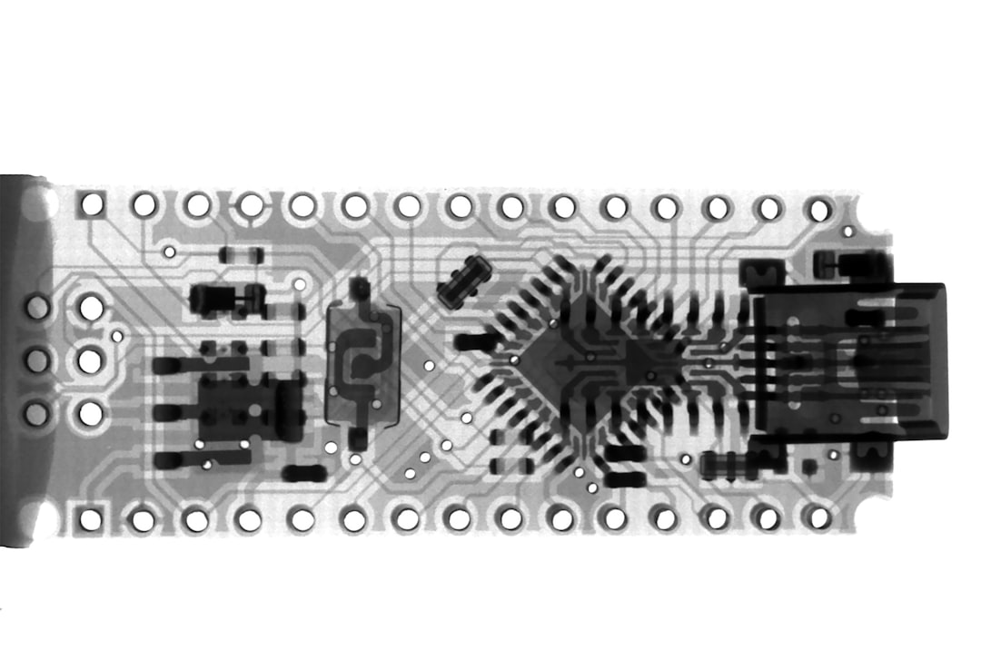 rectangular gray and black board computer mouse internal components, scroll wheel encoder, small circuit board