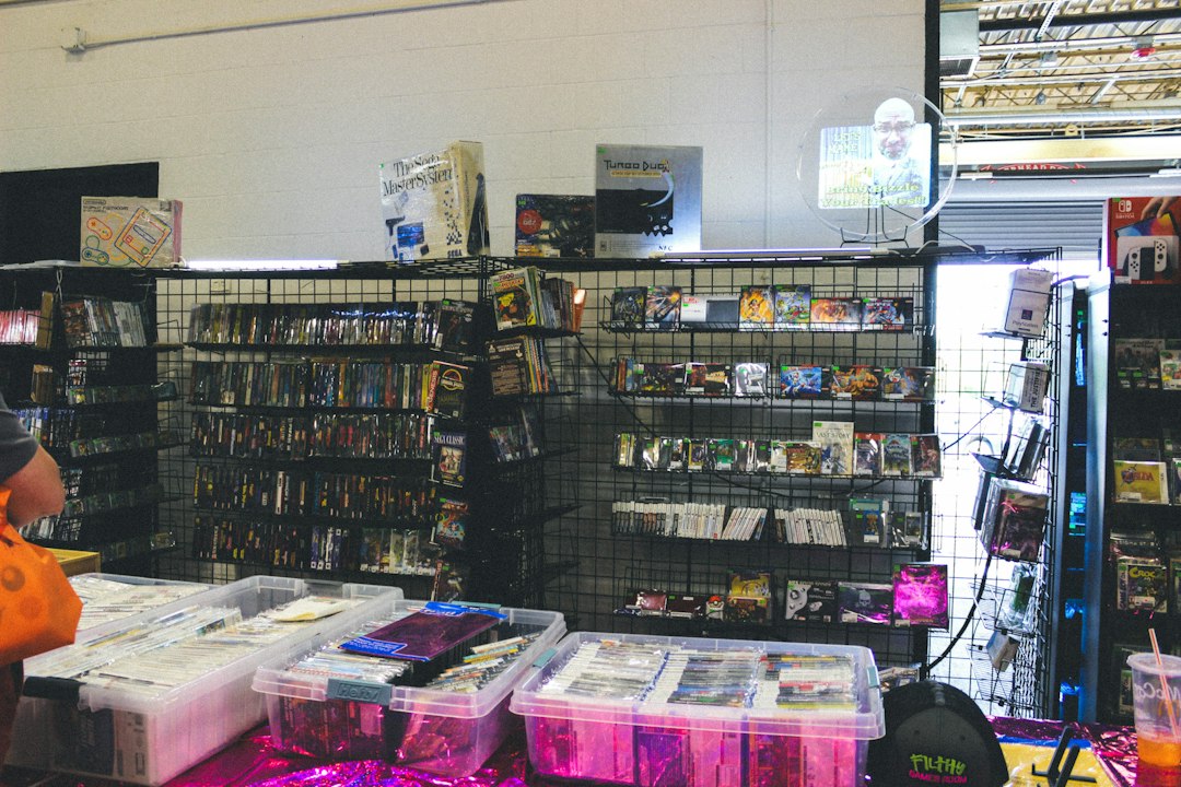 Store interior with shelves of merchandise and items on tables console storefront, game preorder, digital download