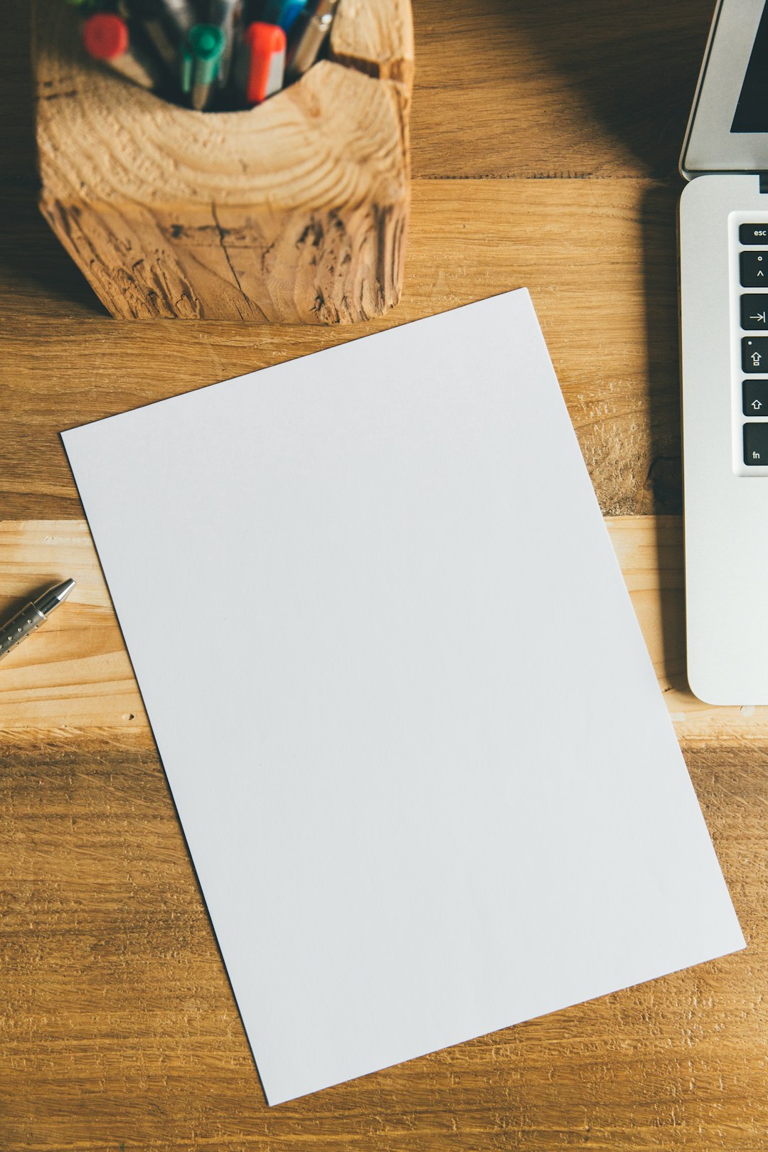 white printer paper beside black pen pdf folder search, document results, office desk