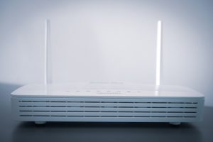 white router on black table wifi router restart, dns settings screen, smartphone network reset option