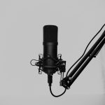 a black and white cable audio waveform, noisy background recording, microphone setup