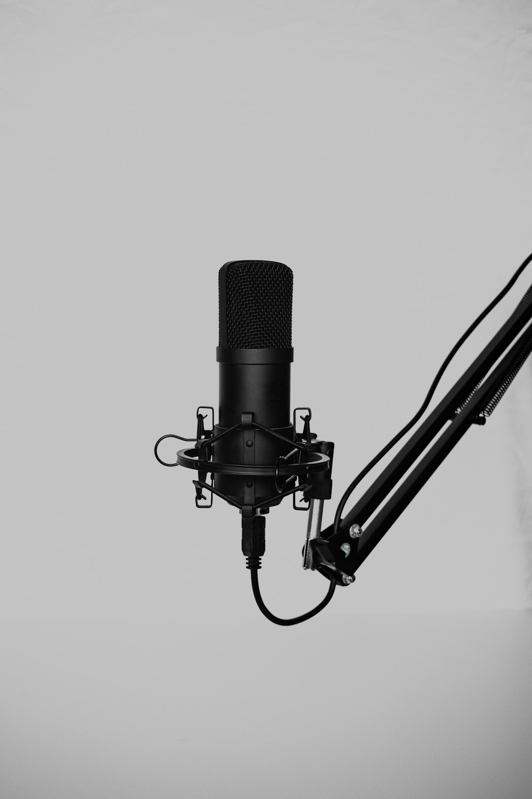 a black and white cable audio waveform, noisy background recording, microphone setup