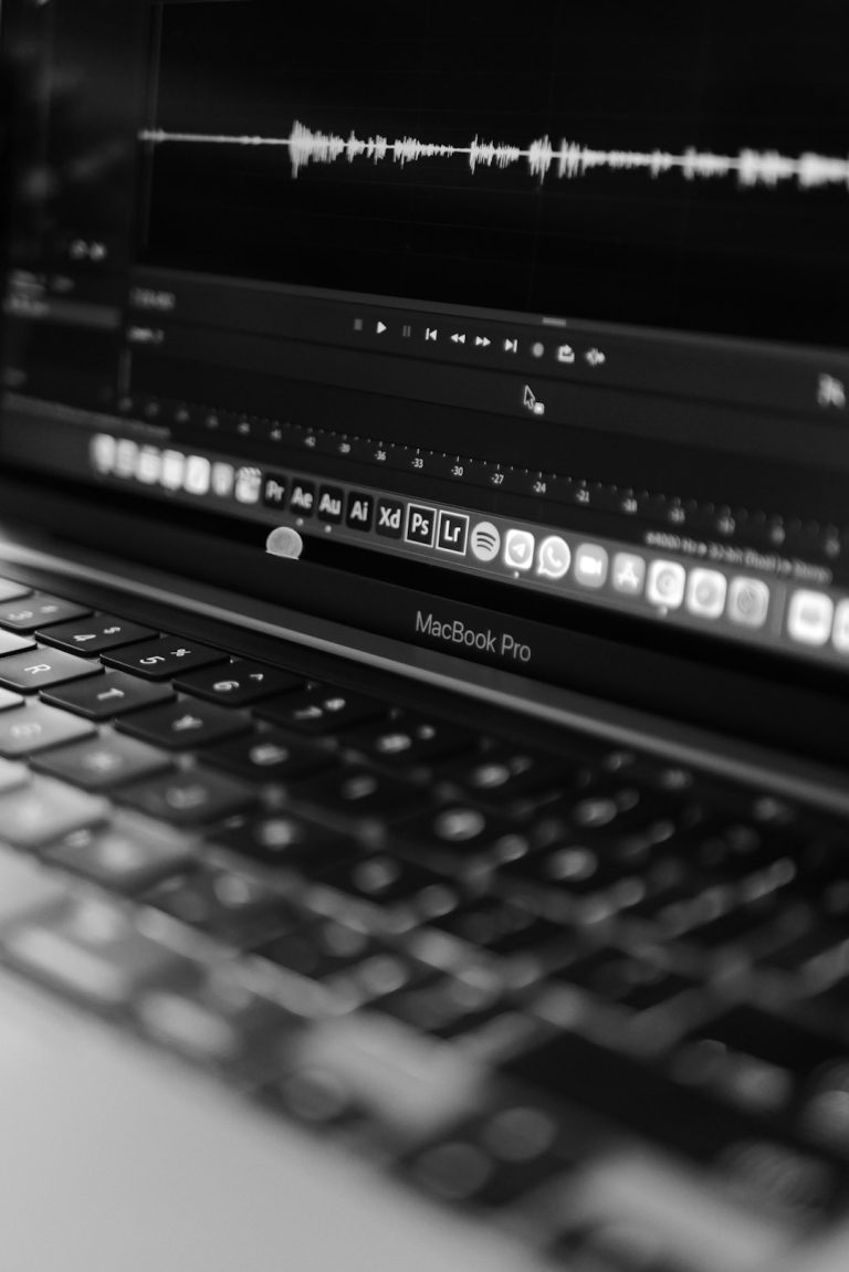 a black and white photo of a laptop old laptop editing photo, simple editing software interface, low end computer workspace