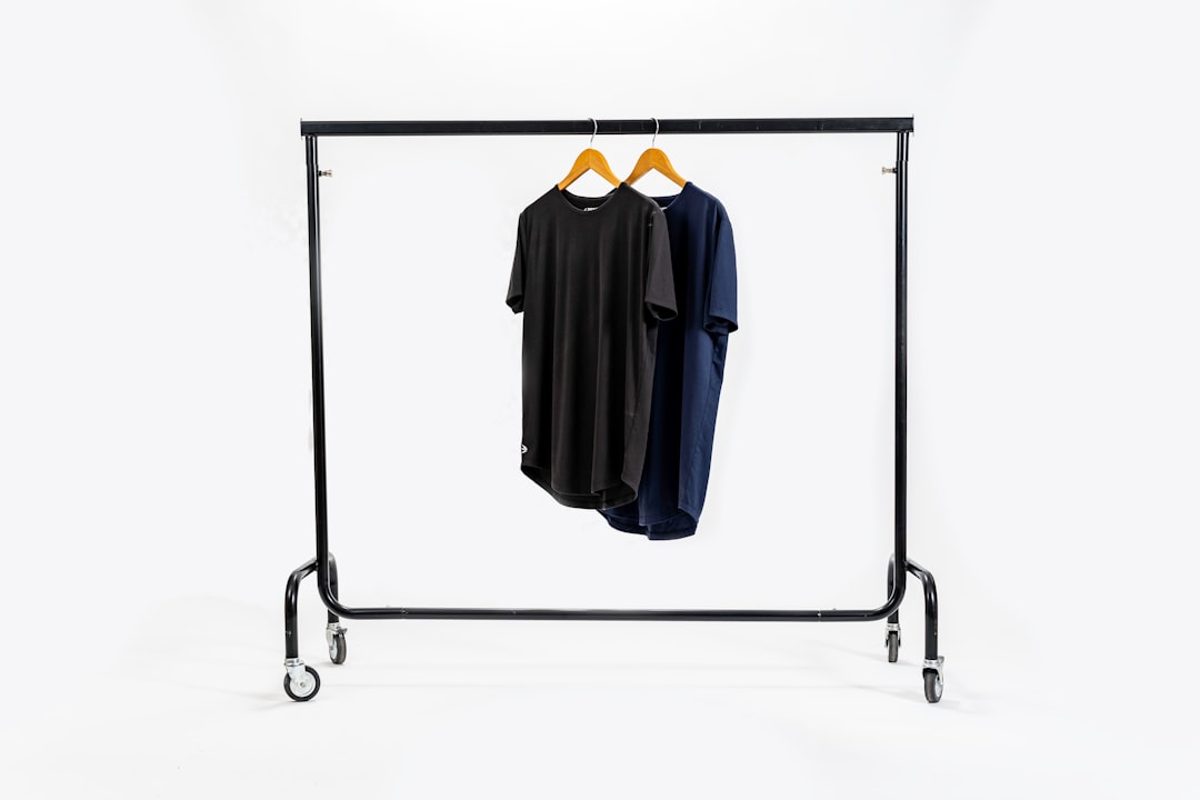 a black coat and pants on a swinger isolated product on transparent background, ecommerce product photo, clean white background comparison