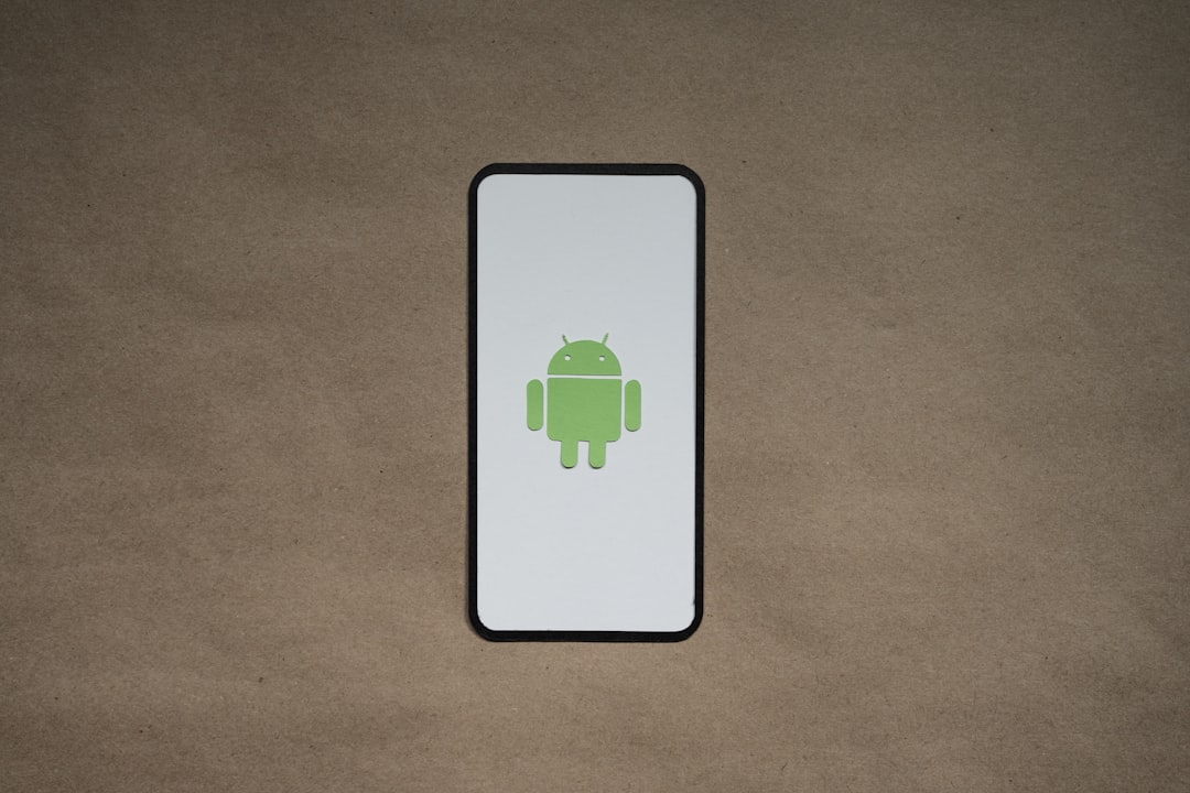 a cell phone with a green icon on it smartphone privacy, android apps, data tracking