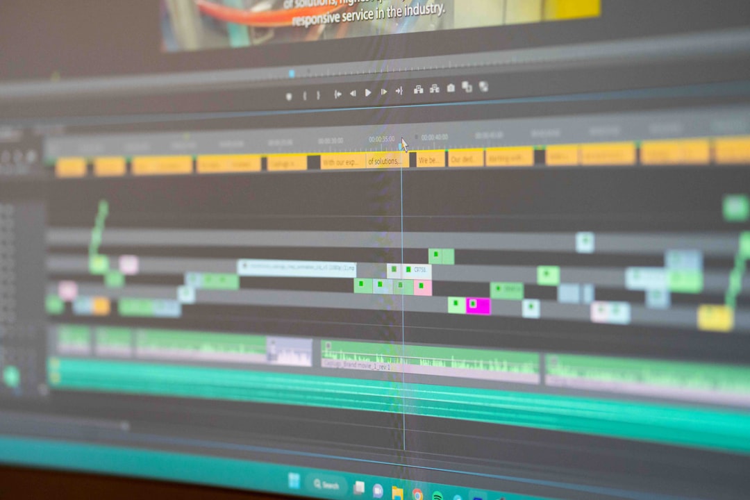 a close up of a computer screen with a keyboard video editing interface, subtitle timeline, transcription software screen