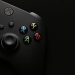 a close up of a video game controller xbox network settings screen, nat type open, xbox live status menu