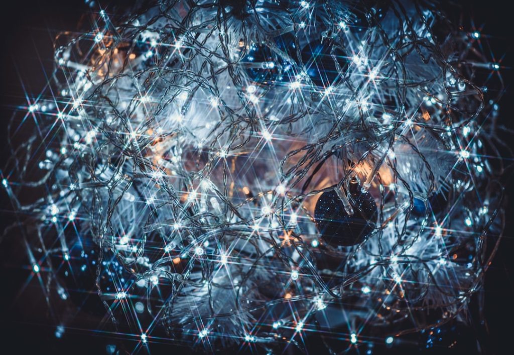 a computer generated image of a ball of lights cybersecurity network map glowing connections world map data encryption