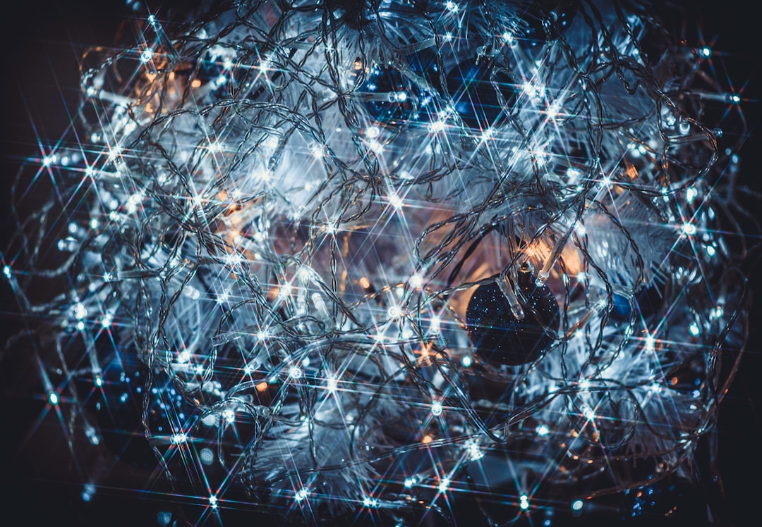 a computer generated image of a ball of lights cybersecurity network map glowing connections world map data encryption