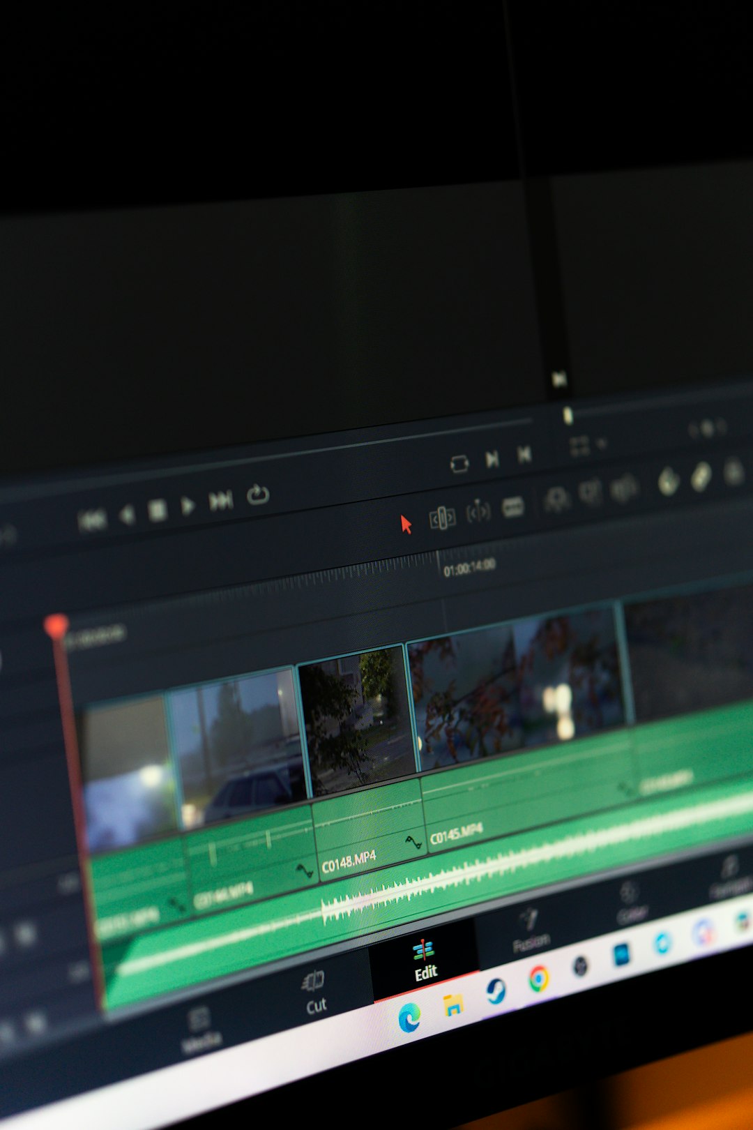 a computer screen with a blurry image of a car video editing interface, subtitle timeline, transcription software screen