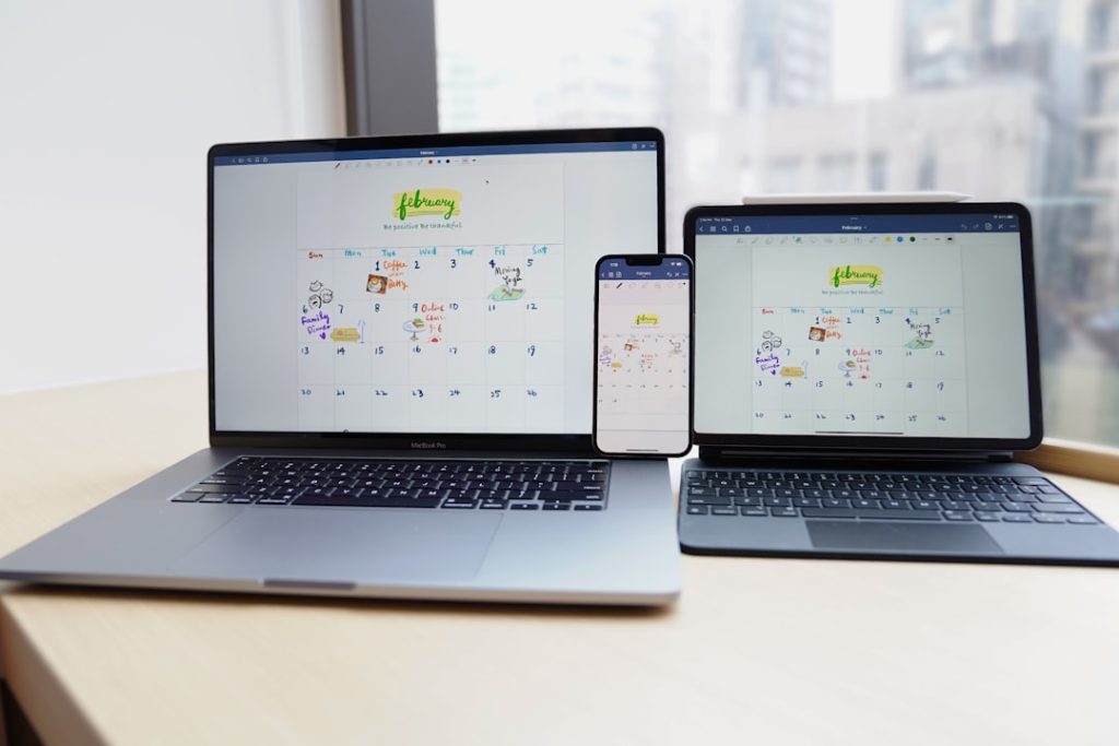 a couple of laptops on a table mobile desktop tablet screenshots, responsive design comparison, device rendering examples