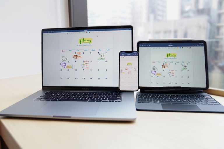 a couple of laptops on a table mobile desktop tablet screenshots, responsive design comparison, device rendering examples