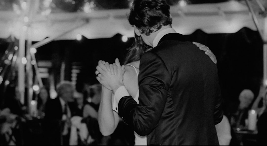 a couple of people that are dancing together 1980s rock musician couple, backstage concert scene, vintage wedding style