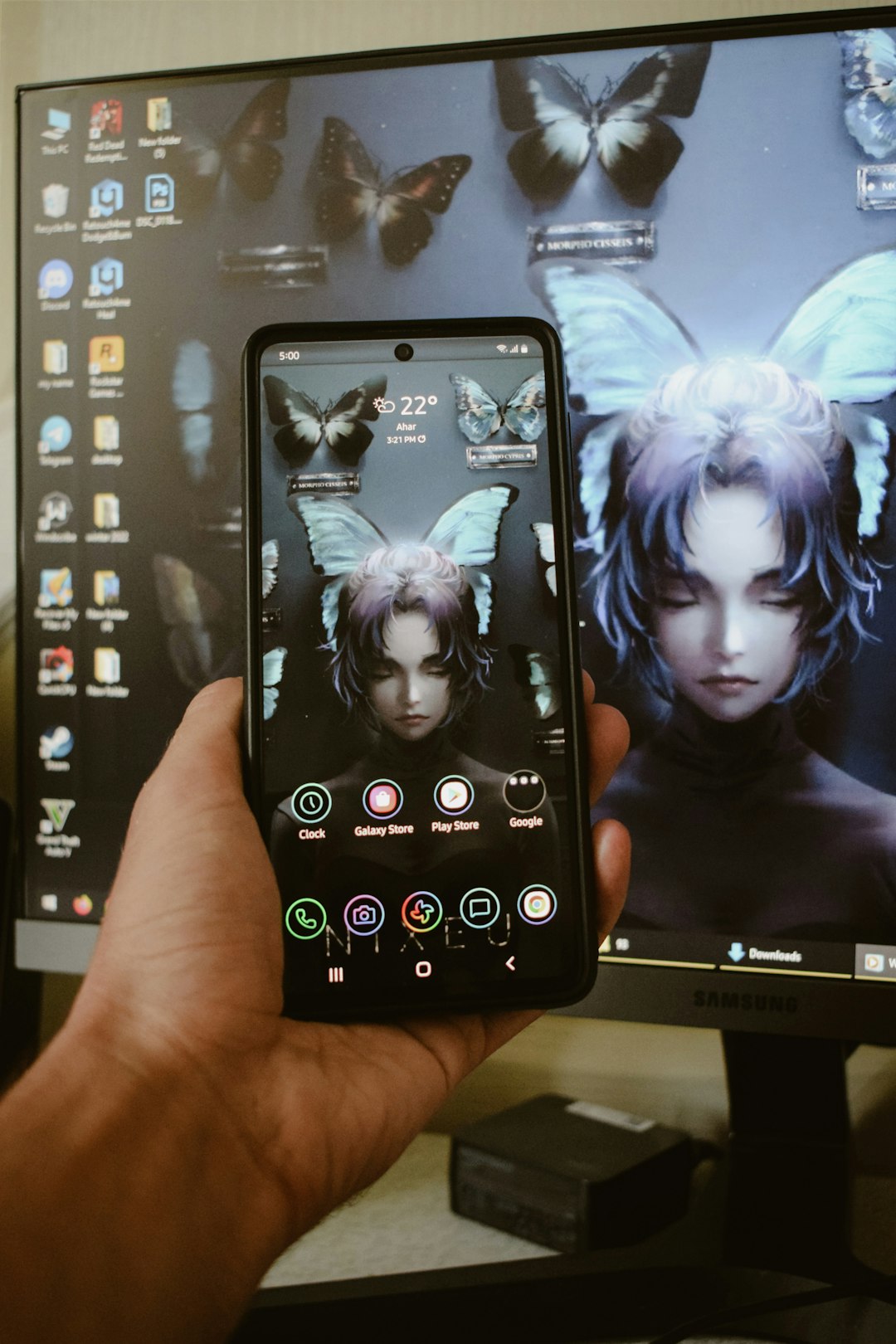 a hand holding a cell phone vertical video editing mobile screen captions overlay