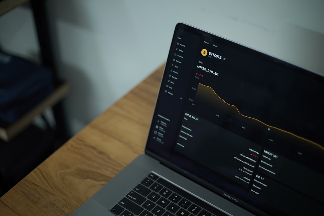 a laptop computer on a desk online banking dashboard, laptop finance screen, digital investment process
