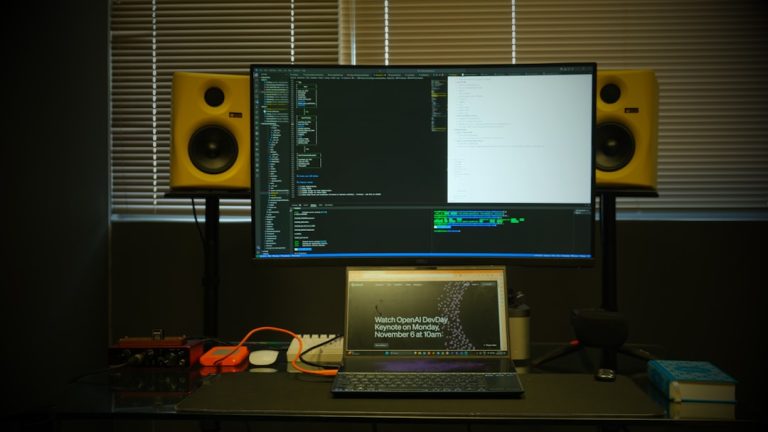 a laptop computer sitting on top of a desk frontend debugging dashboard, session replay interface, error tracking panel