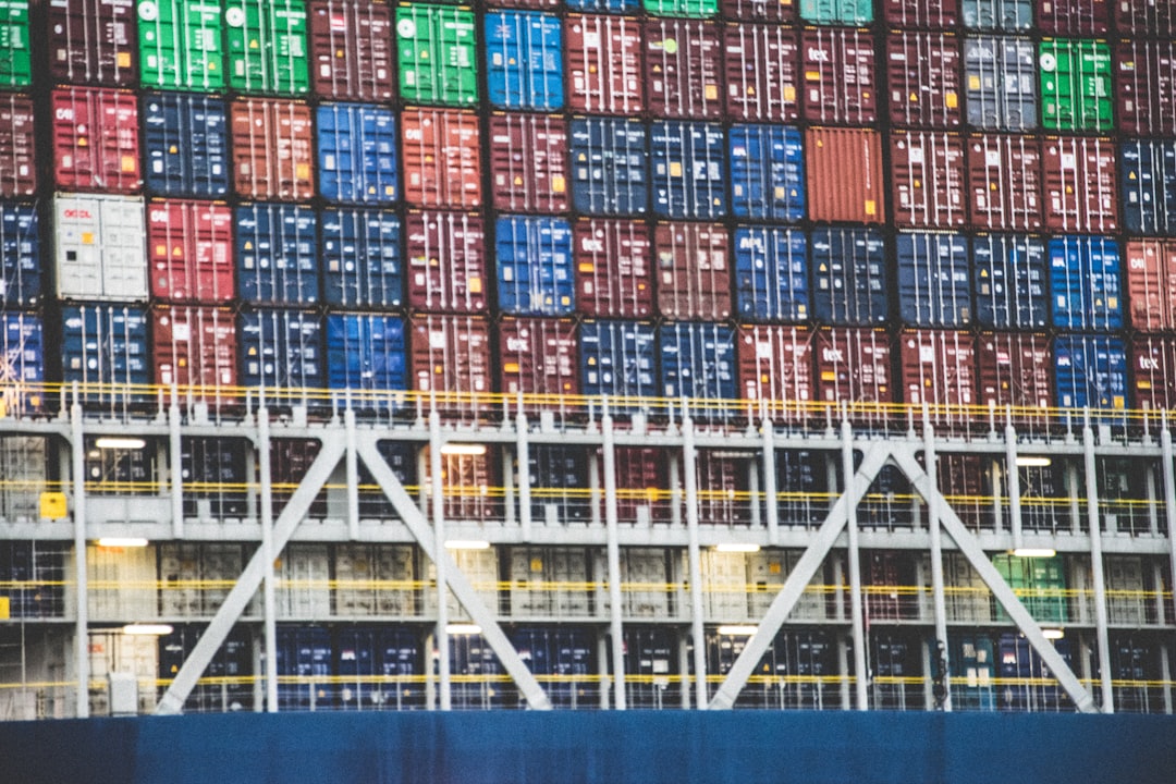 a large stack of containers stacked on top of each other logistics paperwork automation, shipping documents digital processing, supply chain management software