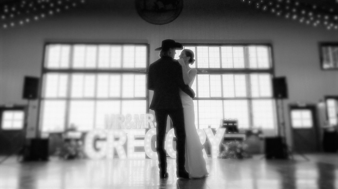 a man and a woman standing in a room 1980s rock musician couple, backstage concert scene, vintage wedding style