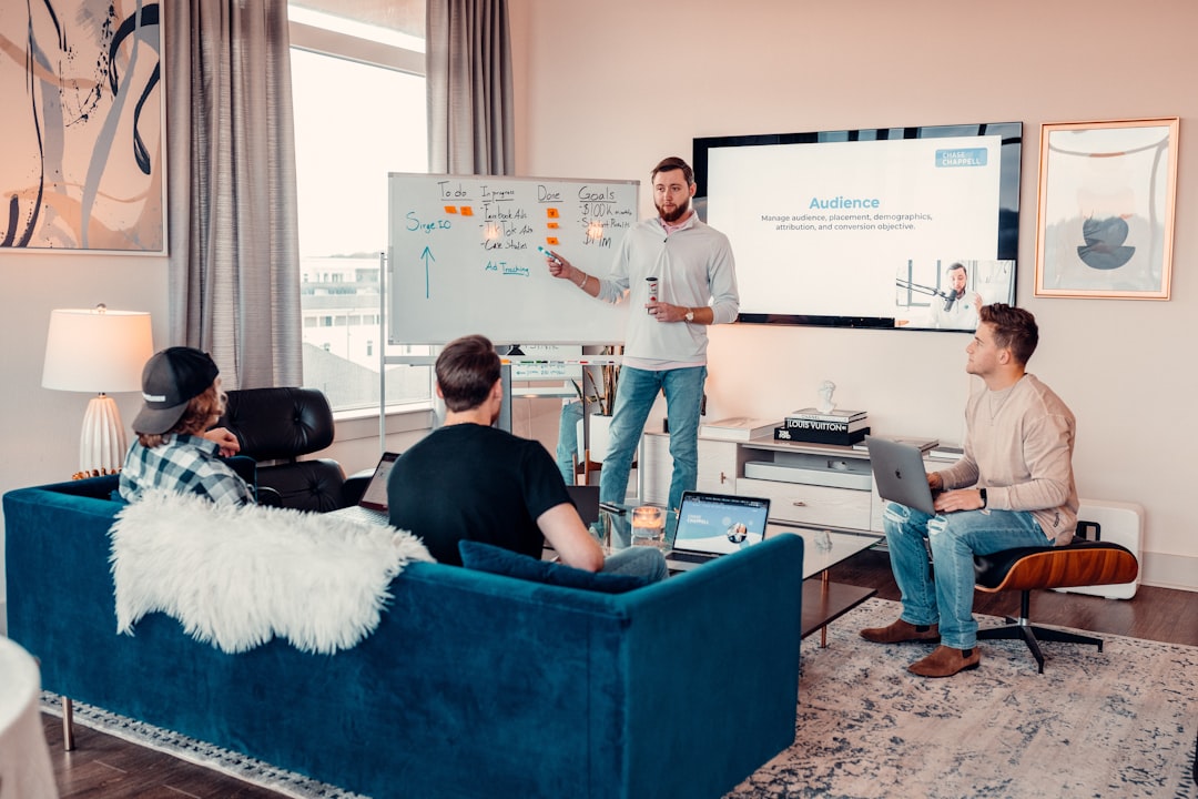 a man giving a presentation to a group of people employee training session, digital documentation workshop, team presentation screen