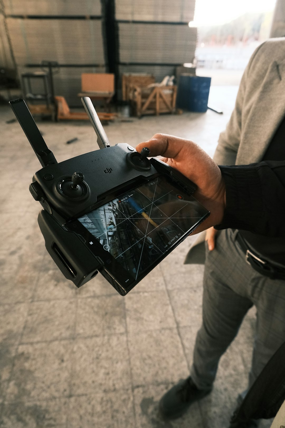 A man holding a tablet in his hand drone pilot reviewing tablet, flight analytics dashboard, team meeting with drone data