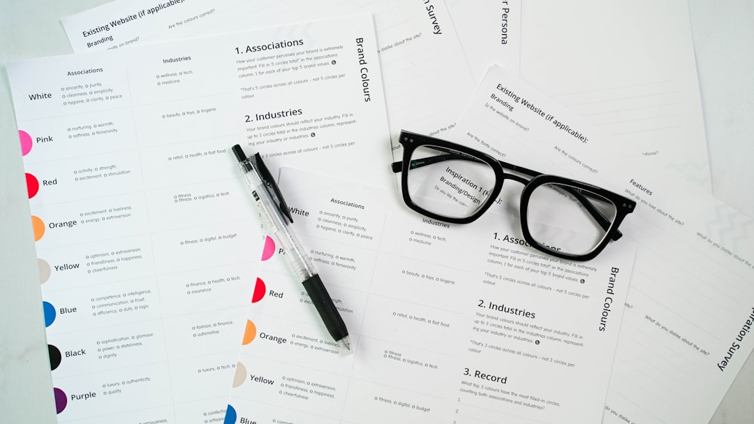 a pair of glasses sitting on top of a pile of paper job interview, resume review, recruiter, candidate