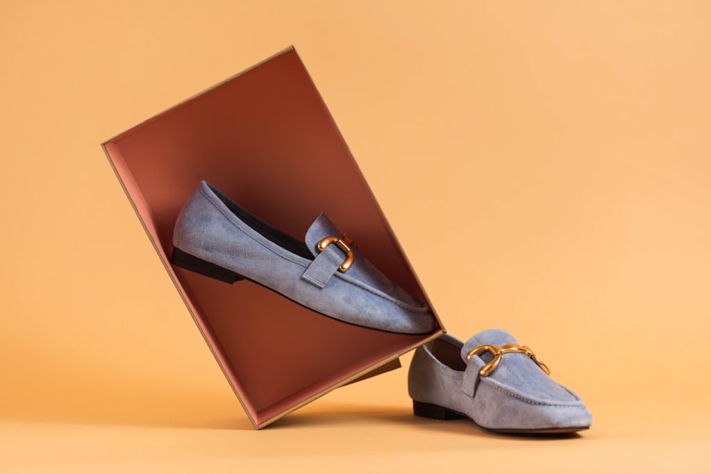 a pair of shoes sitting inside of a box product photography, background removal, ecommerce images
