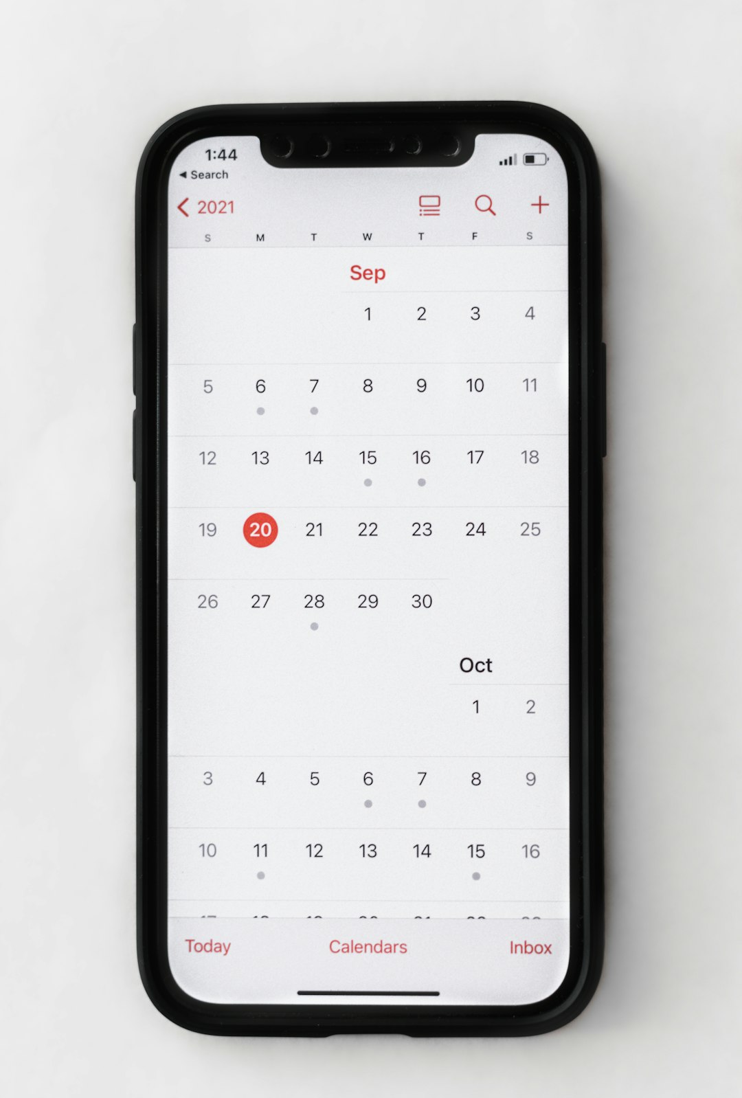 a phone with a calendar on the screen iphone settings app, general date and time, 24 hour time option