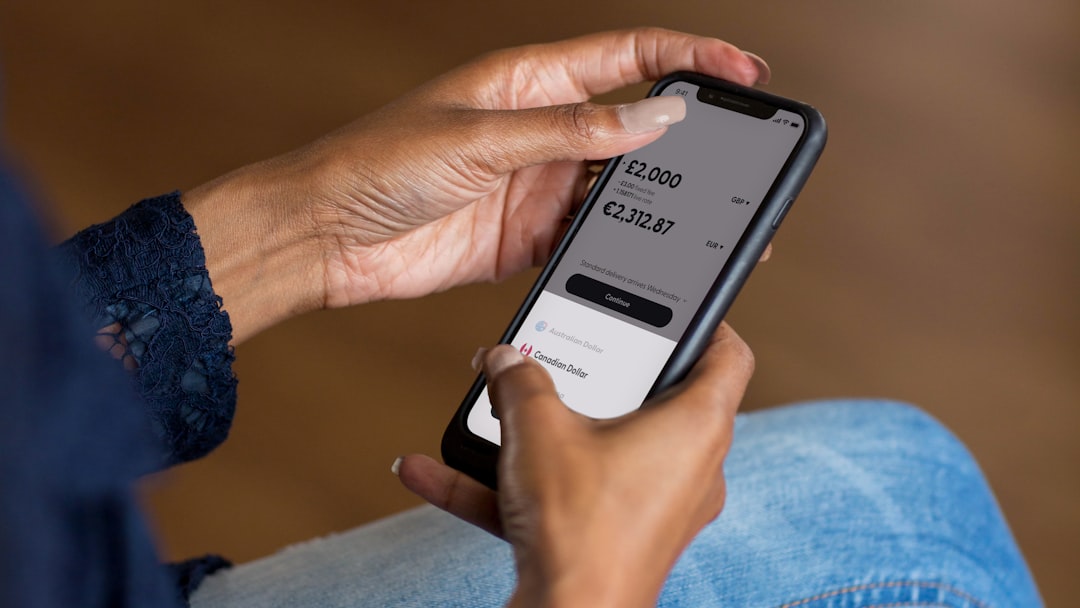 a woman holding a cell phone in her hand secure mobile payments, user trust, subscription app