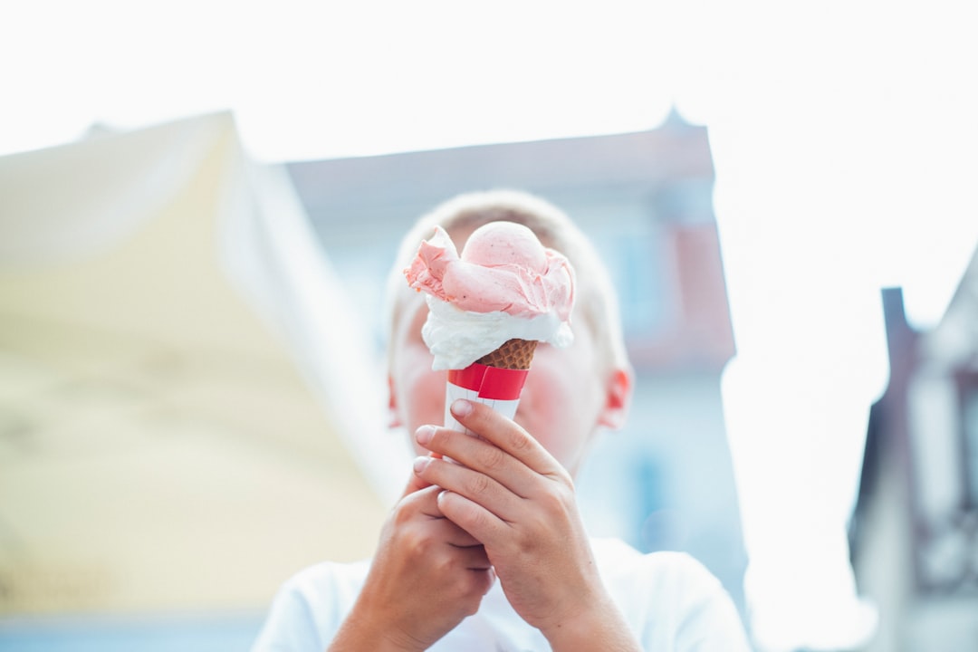 boy holding ice cream with cone ice cream, sunburn, sunny day, correlation example