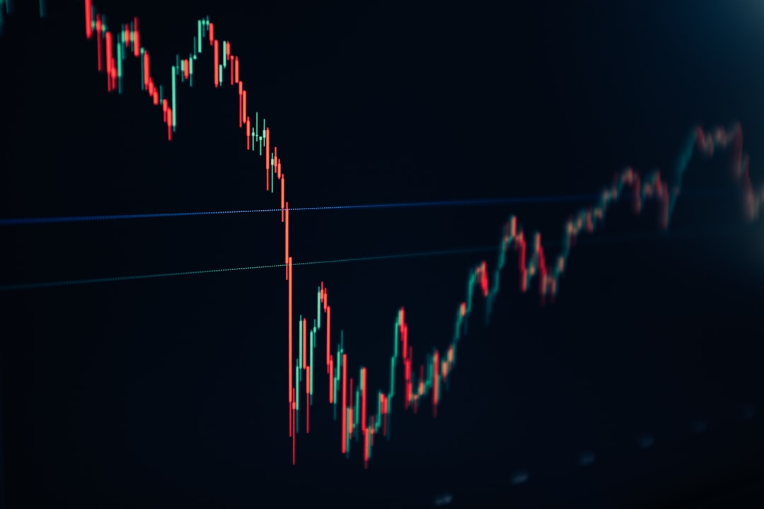 candlestick stock chart on dark screen trader analyzing stock charts, technical indicators, candlestick graph, smartphone trading