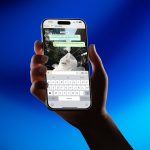 Hand holding smartphone showing messaging app whatsapp export chat screen mobile interface options