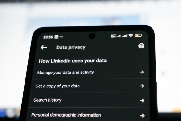 Linkedin data privacy settings on a smartphone screen personal data profile, address search, privacy risk