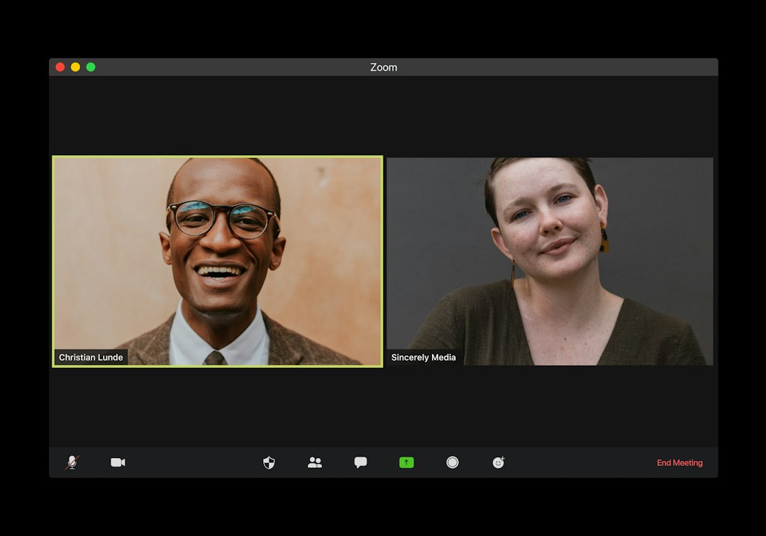 man in black suit jacket smiling video call, meeting bot, transcript summary