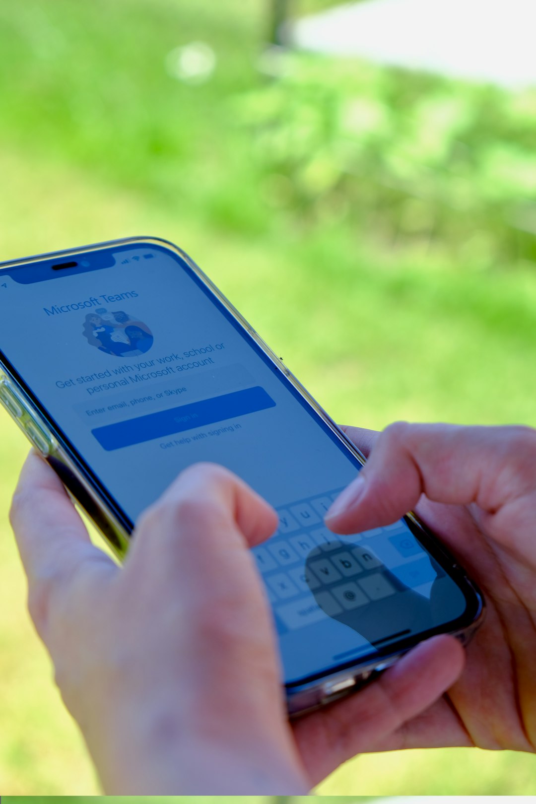 person holding iphone 6 with blue case person using smartphone for banking, security verification screen, two factor authentication code, secure mobile login