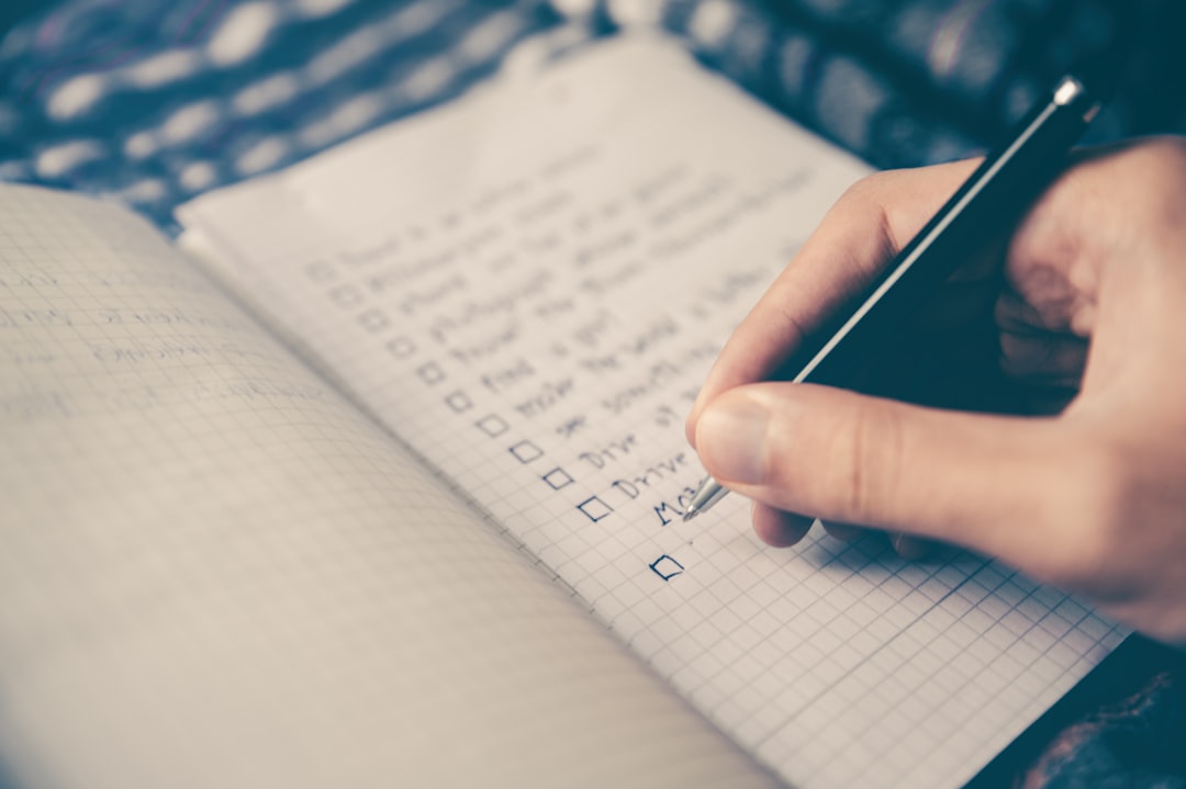 person writing bucket list on book checklist, digital privacy, account deletion