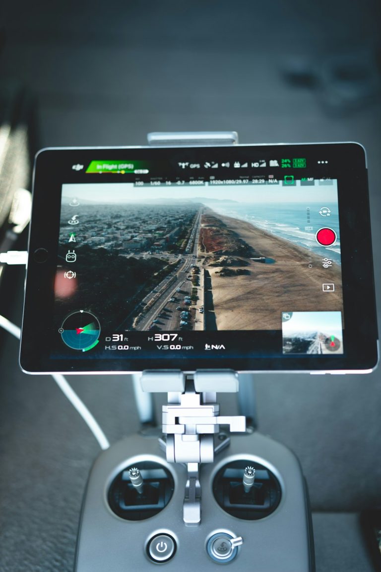 turned-on drone LED monitor drone pilot reviewing tablet, flight analytics dashboard, team meeting with drone data