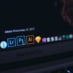 turned on MacBook Pro video editing dashboard multiple formats social media icons