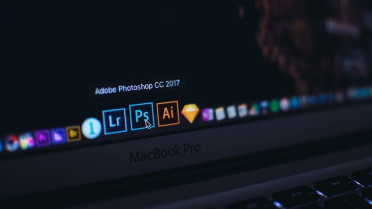 turned on MacBook Pro video editing dashboard multiple formats social media icons